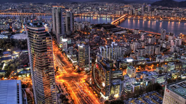 Night view of Seoul Korea cityscape with illuminated buildings and river in 4K quality