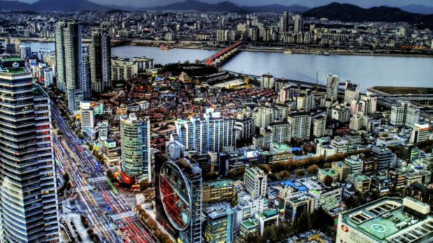 Aerial view of Seoul Korea cityscape with river and high rise buildings at dusk