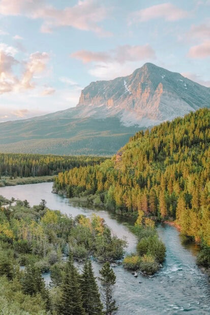 A river flows through the forest with a mountain peak in the background in Montana Wallpapers, HD Mobile Wallpaper