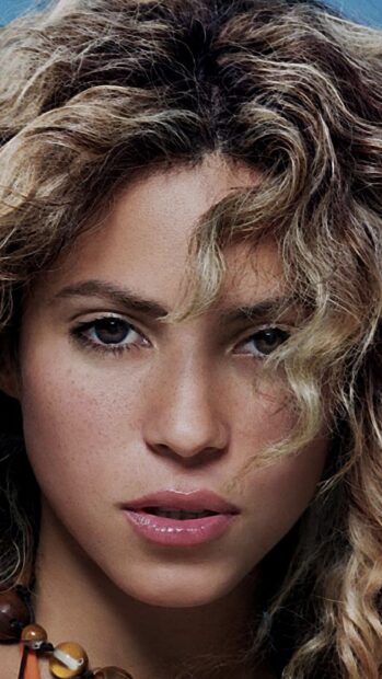 A close up of Shakira's face featuring her curly hair and natural expression with Shakira Wallpapers, HD Phone Wallpaper