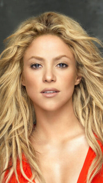 Shakira portrait with flowing blonde hair and red outfit, 4K Phone Wallpaper