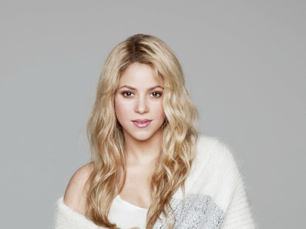 Shakira Wallpapers showing a close up of the singer wearing a white knit sweater, HD Desktop Wallpaper