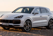 A silver Porsche Cayenne is parked near the coast with the ocean in the background, HD Desktop Wallpaper
