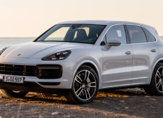A silver Porsche Cayenne is parked near the coast with the ocean in the background, HD Desktop Wallpaper