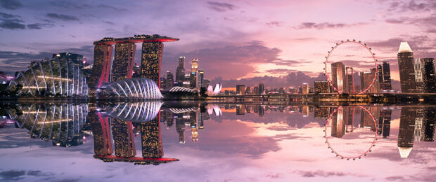 Stunning Singapore skyline at dusk with iconic landmarks reflected on calm water