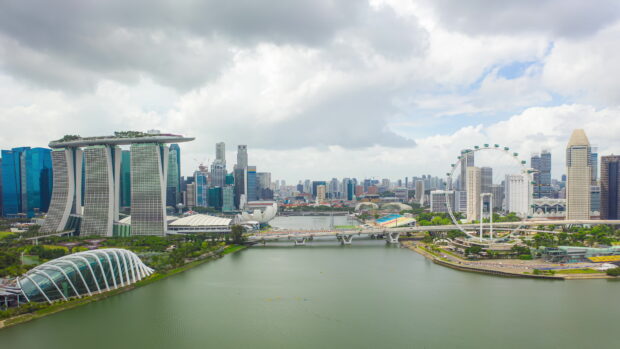 A panoramic view of Singapore skyline featuring iconic skyscrapers and waterfront in high resolution