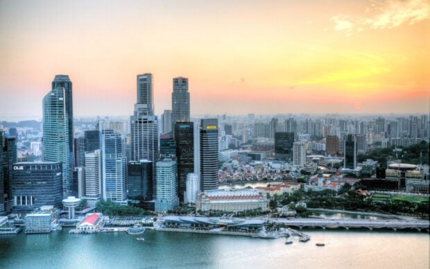 A high view of Singapore skyline showing modern skyscrapers and cityscape at sunset