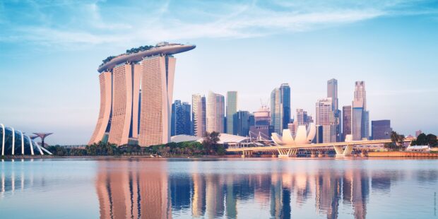 Singapore skyline featuring modern skyscrapers and Marina Bay Sands reflecting on calm water