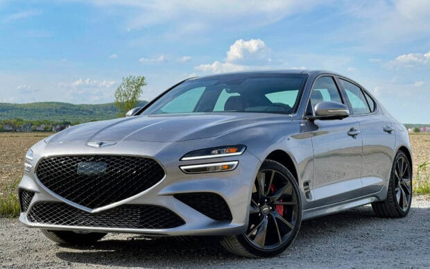 A silver Genesis car parked on a gravel road under a blue sky, HD Desktop Wallpaper