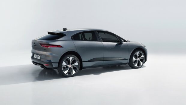 A sleek Jaguar I Pace electric vehicle is shown from the side with modern design, HD Desktop Wallpaper