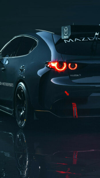 A sleek Mazda racing car shows its illuminated rear lights and sporty design, HD Phone Wallpaper