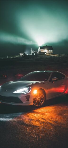 Toyota sports car at night with northern lights in the background.