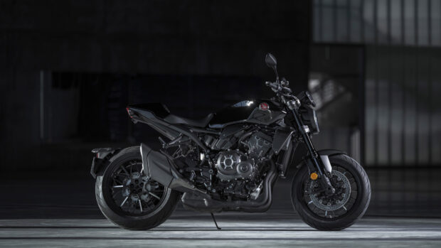 A black Honda CB1000R motorcycle parked in a dark garage setting, 4K Desktop Wallpaper