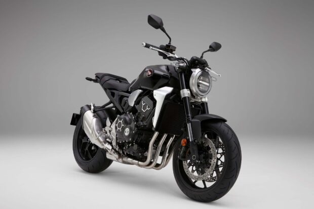A sleek black Honda CB1000R motorcycle is showcased on a plain background highlighting its design, 2K Desktop Wallpaper