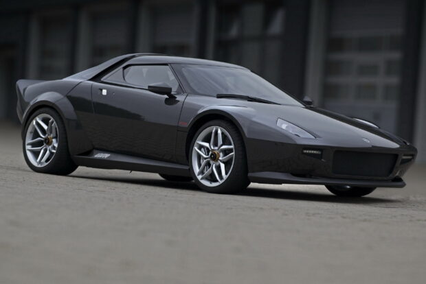 A sleek black Lancia sports car is parked on a concrete surface near a modern building, HD Desktop Wallpaper