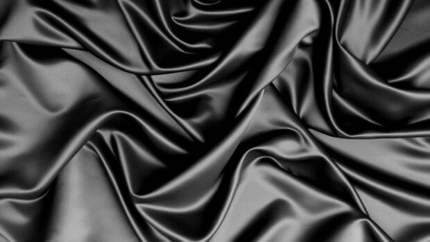 The smooth black silk fabric displays elegant folds and texture, HD Desktop Wallpaper
