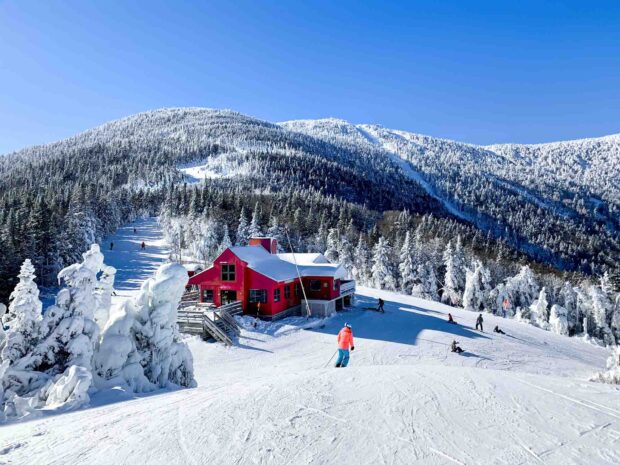 A snowy mountain lodge surrounded by frosted trees and skiers in Vermont Wallpapers, HD Desktop Wallpaper