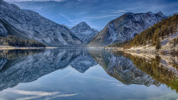 A clear lake reflects snow covered mountains and trees in Austria Wallpapers, HD Desktop Wallpaper