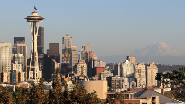Space Needle tower and Seattle skyline with Mount Rainier in the background