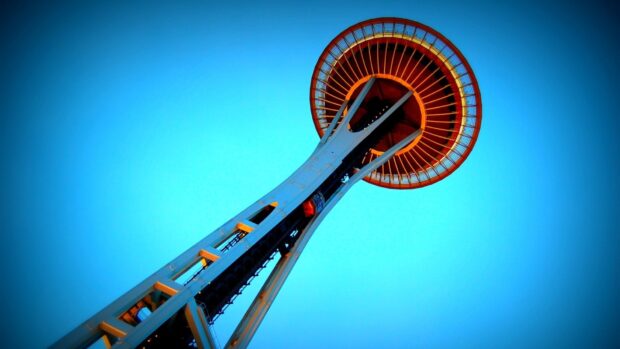 A clear view of the Space Needle structure against a bright blue sky