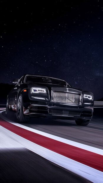 A black Rolls Royce Ghost drives on a curved road under a starry night sky, 4K Phone Wallpaper