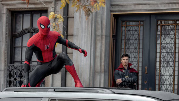 Spider Man Tom Holland crouches on a vehicle with Doctor Strange in the background, HD Desktop Wallpaper