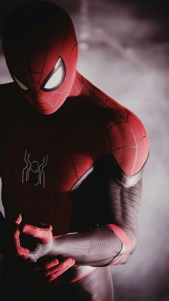 Spider Man Tom Holland adjusts his suit in a detailed close up shot, HD Phone Wallpaper