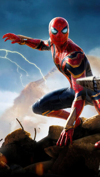 Spider Man Tom Holland crouches on rubble ready for battle under a stormy sky, 4K Phone Wallpaper