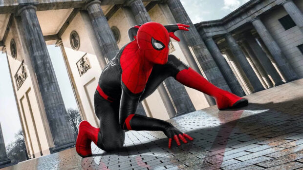 Spider Man Tom Holland in a black and red suit crouching on a tiled floor near large stone columns, HD Desktop Wallpaper