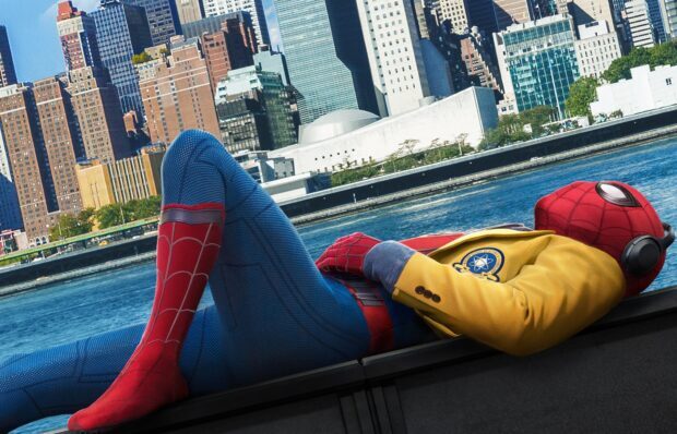 Spider Man Tom Holland is seen lying down wearing a yellow jacket, HD Desktop Wallpaper