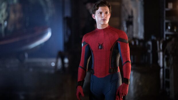 Tom Holland as Spider Man stands alert in his red suit, 4K Desktop Wallpaper