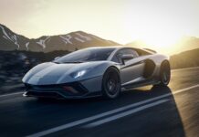 A sporty luxury car drives down the mountain road at sunset with lp wallpapers, 4K Desktop Wallpaper