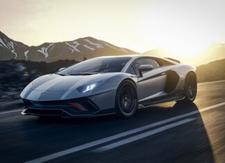 A sporty luxury car drives down the mountain road at sunset with lp wallpapers, 4K Desktop Wallpaper