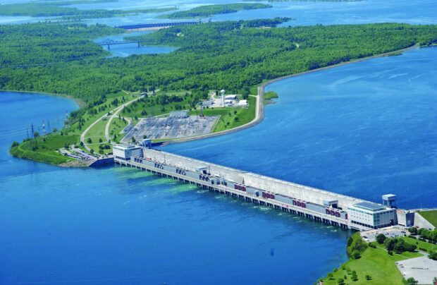 Aerial view of the St Lawrence River dam surrounded by green landscape and blue water