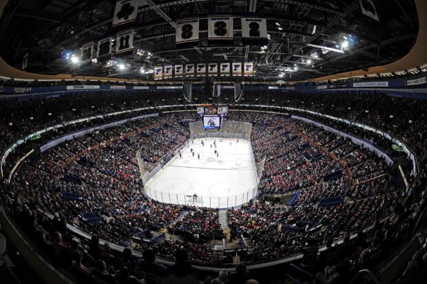 A packed arena watching a St Louis Blues game on an ice hockey rink, 2K Desktop Wallpaper