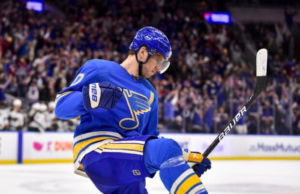 A St Louis Blues player celebrates on the ice during a game with a raised fist, 2K Desktop Wallpaper