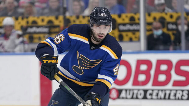 A St Louis Blues player wearing a blue uniform focusing during a hockey game, 4K Desktop Wallpaper