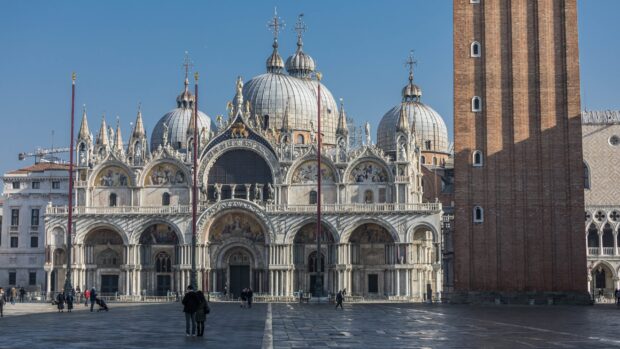 The St Marks Basilica stands with its intricate domes and arches under a clear sky, 2K Desktop Wallpaper