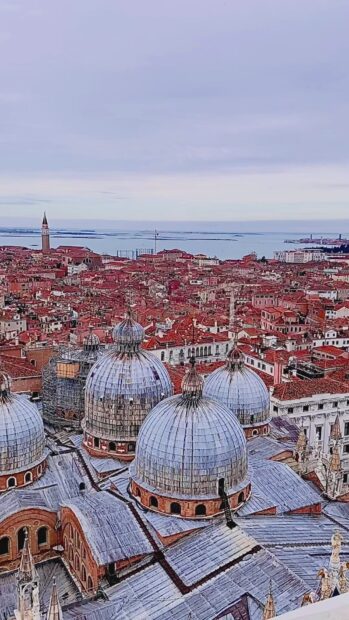 The aerial view shows St Marks Basilica domes and the nearby city with a sea background, HD Mobile Wallpaper
