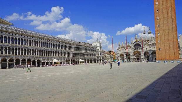 The St Marks Basilica under a bright blue sky with people walking around the plaza, 2K Desktop Wallpaper