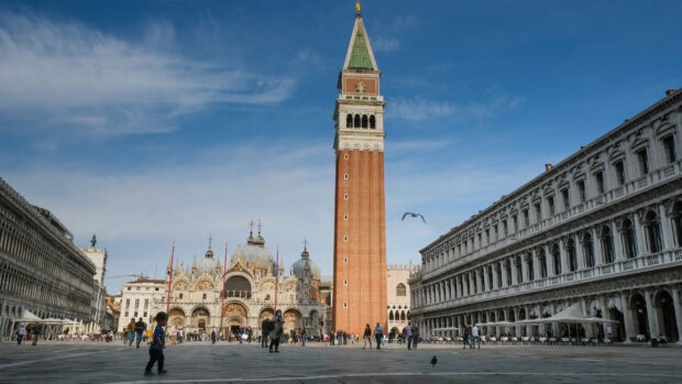St Marks Basilica with bell tower and tourists on the square under a blue sky, 2K Desktop Wallpaper