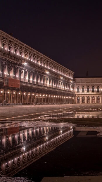 The illuminated St Marks Square shows a clear reflection on the wet ground under the night sky, HD Mobile Wallpaper