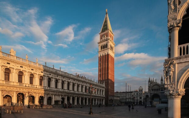 The St Marks Square shows historic architecture under a blue sky with scattered clouds, 2K Desktop Wallpaper