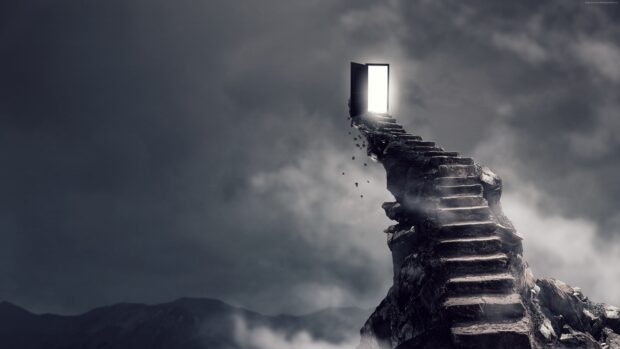 A rocky staircase leading to an open door surrounded by clouds and mist