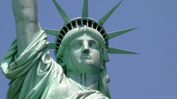 A close up view of the Statue of Liberty against a clear blue sky, HD Desktop Wallpaper