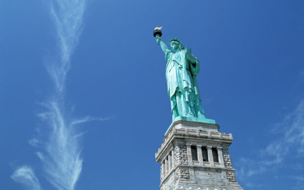 The Statue of Liberty stands tall with a clear blue sky and wispy clouds behind it, HD Desktop Wallpaper