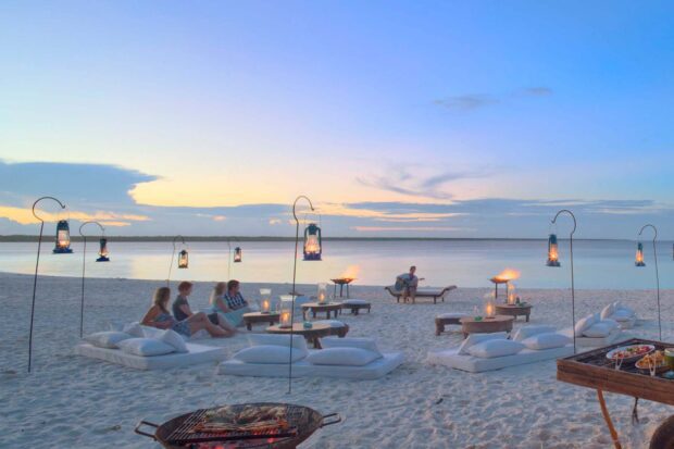 People relax on the sandy shore under lantern light at Zanzibar with Zanzibar Wallpapers, HD Desktop Wallpaper