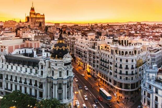 The Spain Wallpapers cityscape shows a sunset view over Madrid streets and historic buildings, 2K Desktop Wallpaper