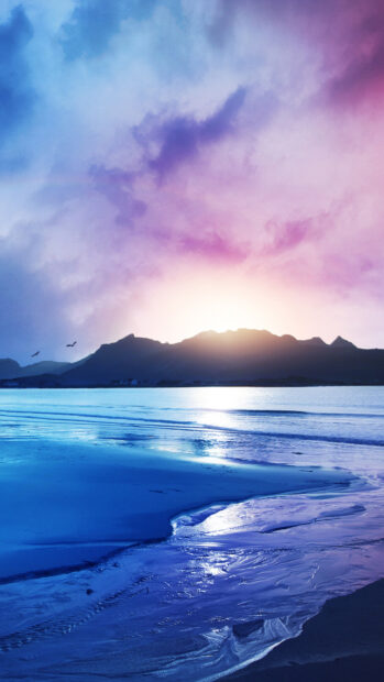 The scenery wallpapers show a vibrant sunset behind mountains with ocean waves, 4K Phone Wallpaper