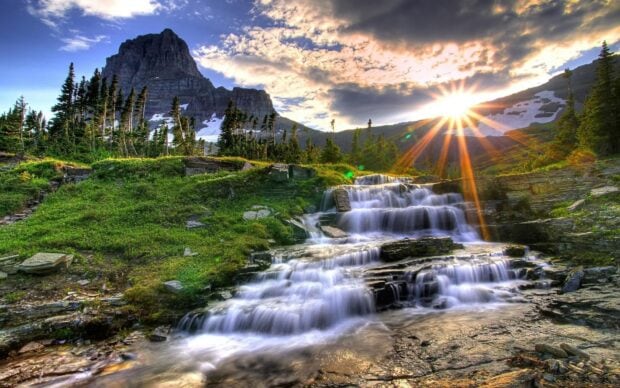 The scenery wallpapers show a cascading waterfall under a setting sun with mountains and green trees, HD Desktop Wallpaper